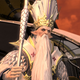 A stern-looking, pope-like figure with an incredibly long, white beard.